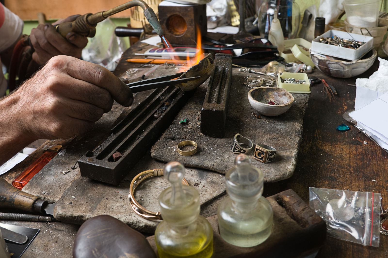 Traditional precious-metal work at a jewellery bench