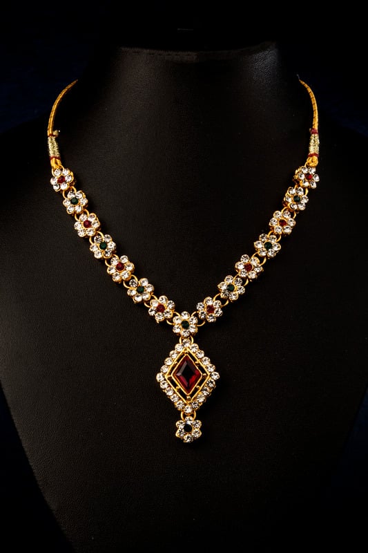 Finished gold and gemstone necklace